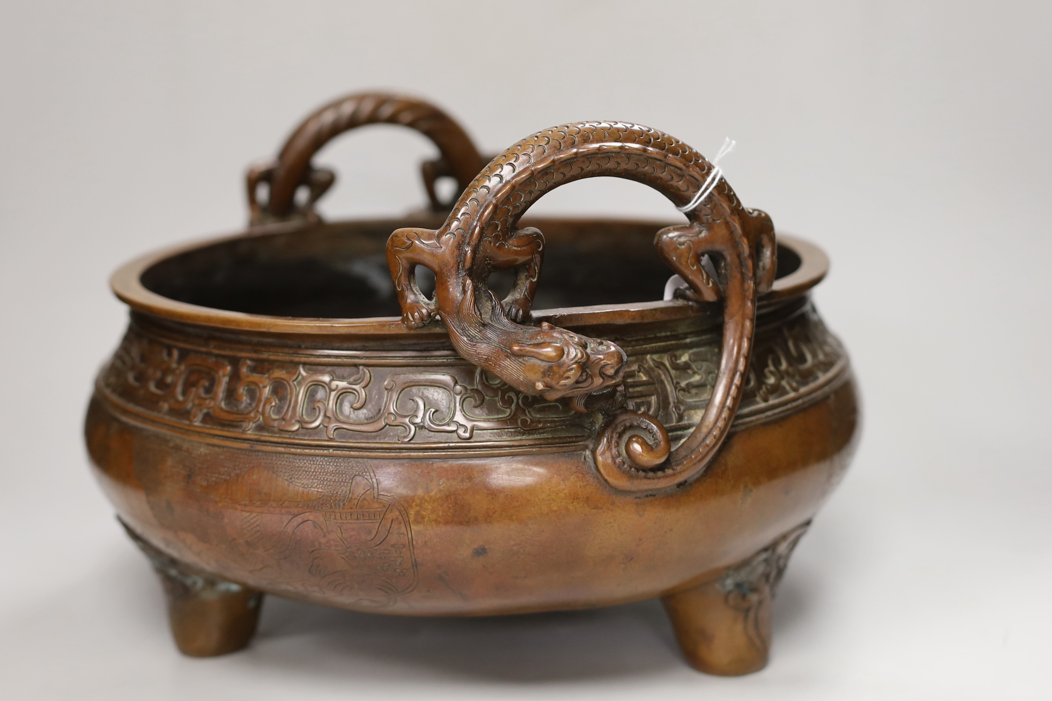 A massive Chinese brown patinated bronze ding censer, with dragon handles, 23.5cm including handles high